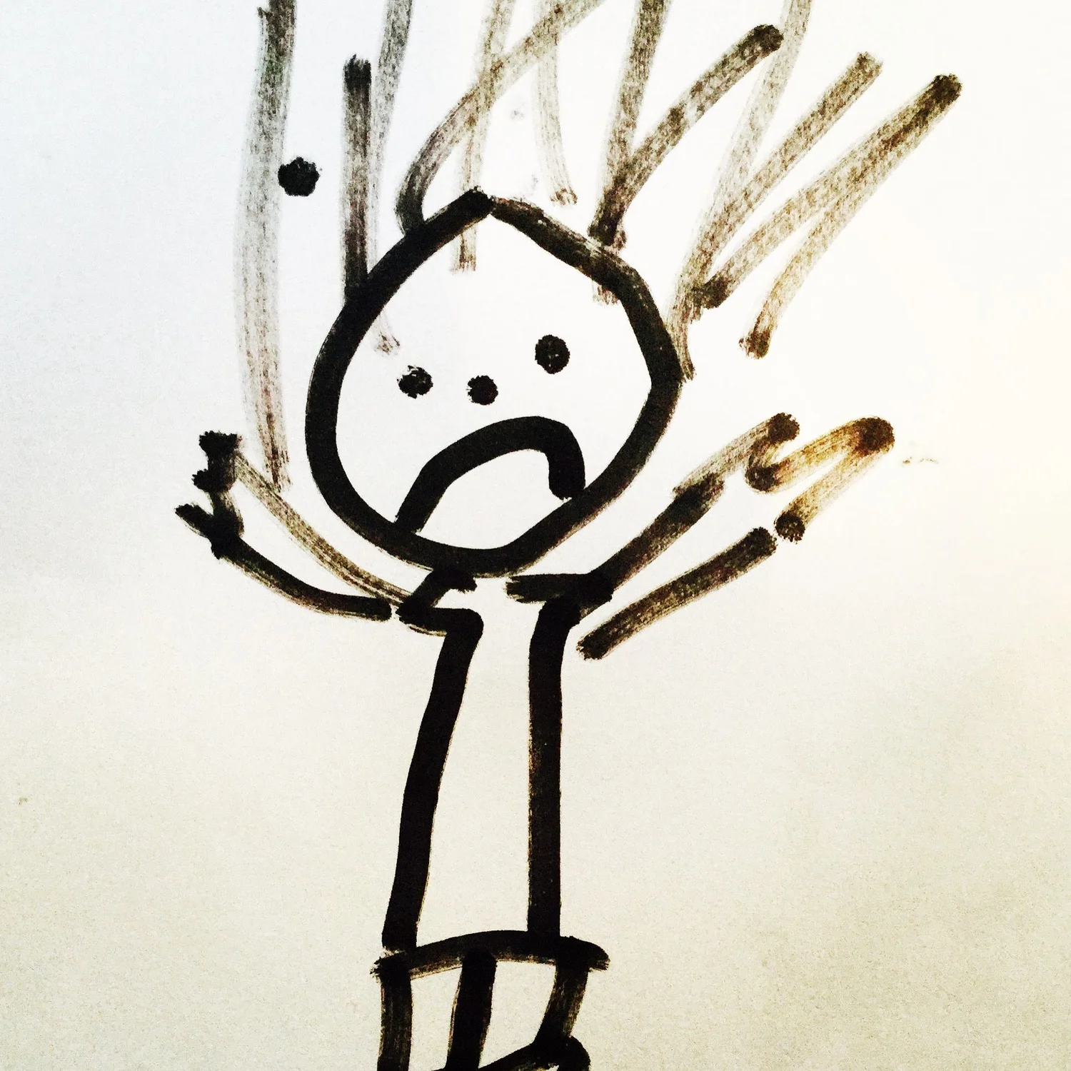 A child's drawing of an unhappy stick figure