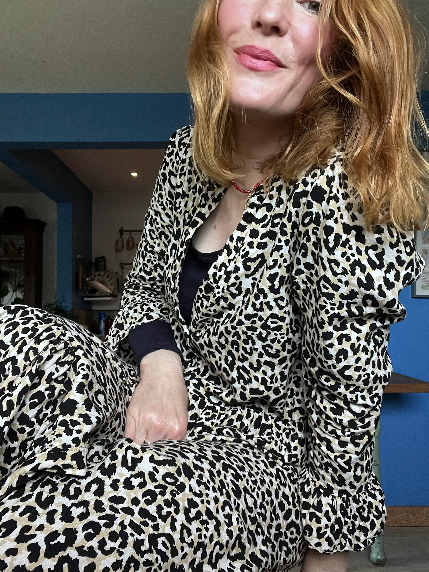 A woman in a leopard-print coat
