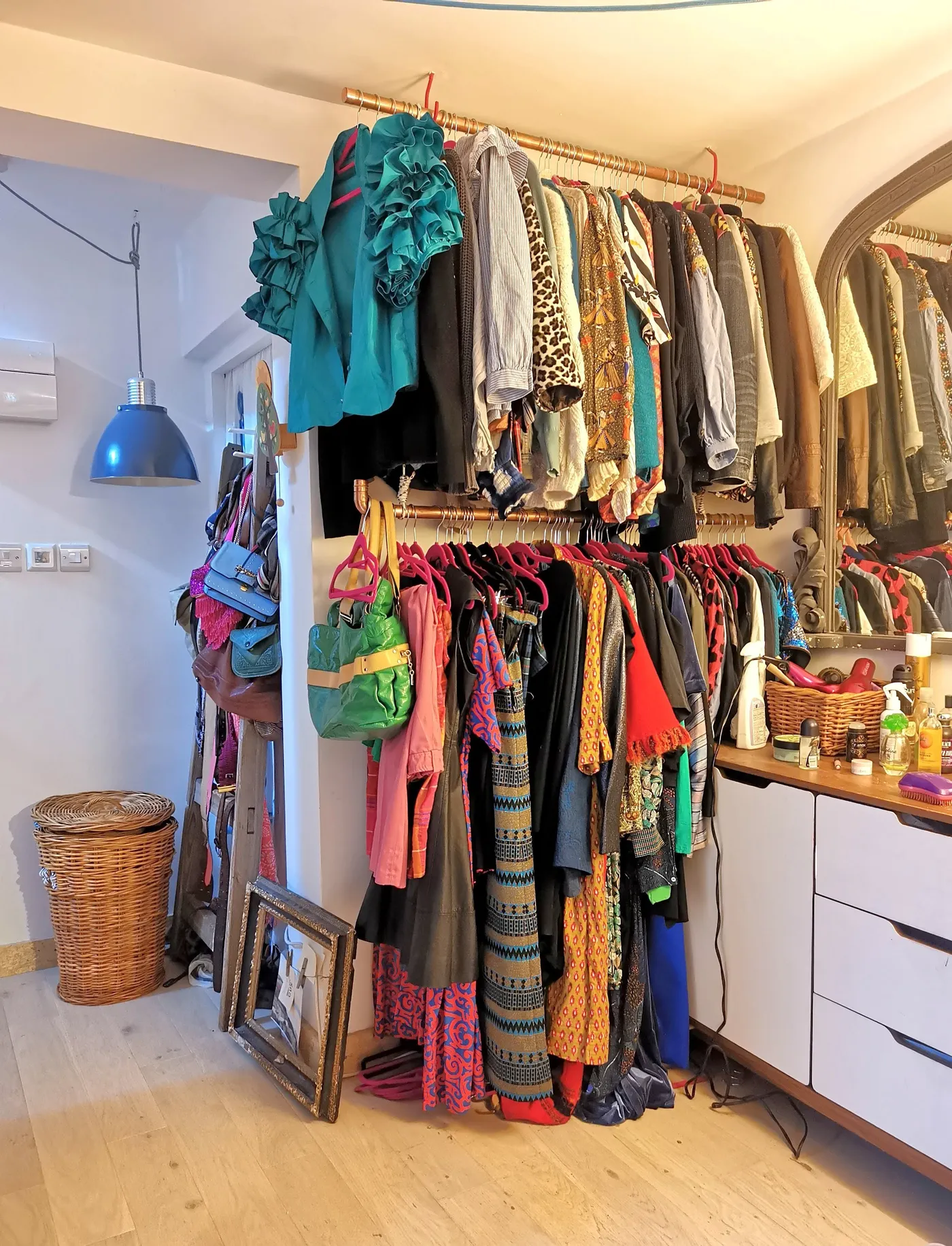 A rail of colourful second-hand clothes