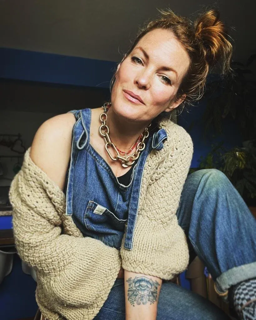 Anna Kilpatrick in a second-hand cardigan and denim dungarees